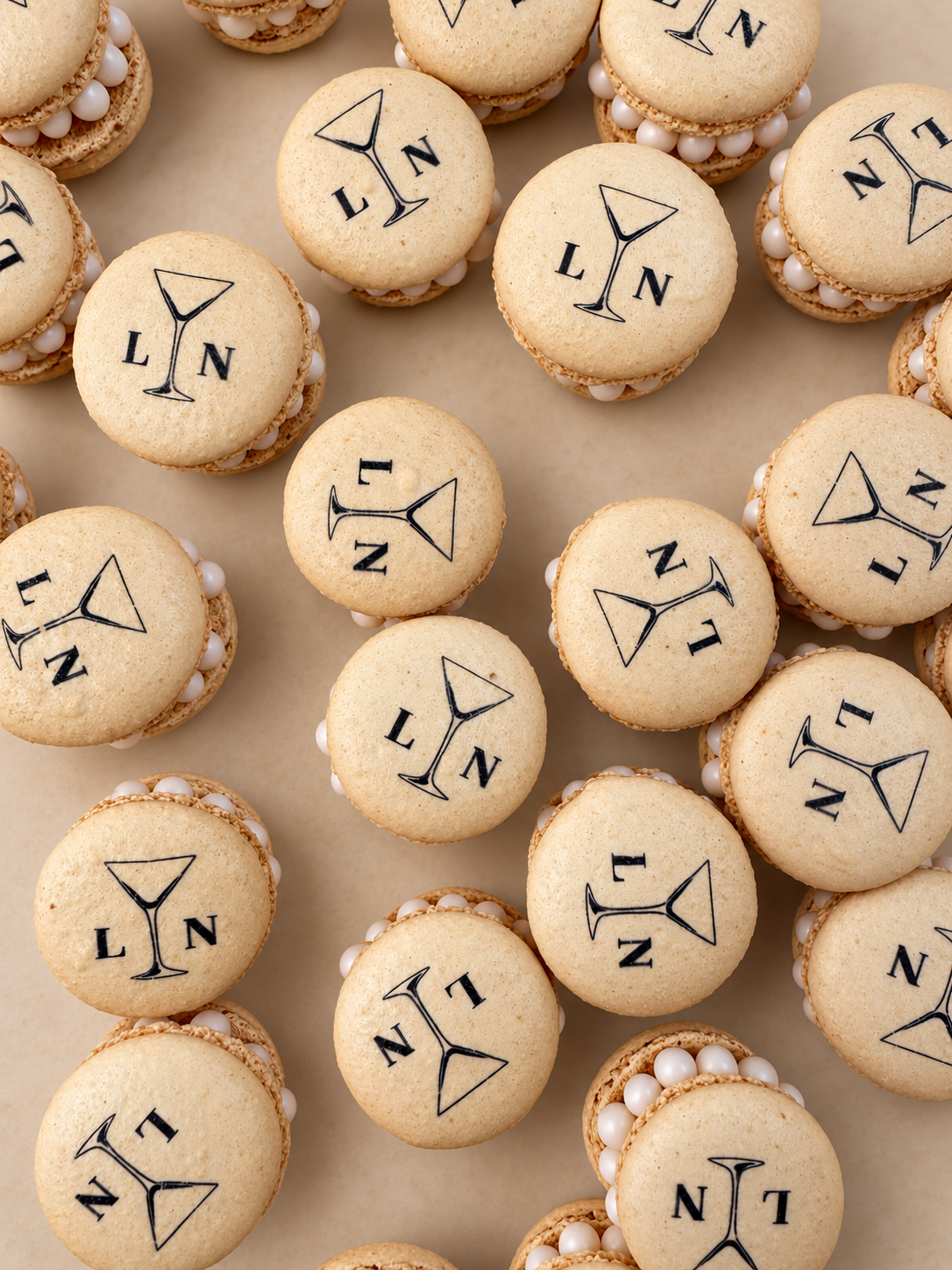 Ivory French macarons printed with the bride and groom’s initials, L and N