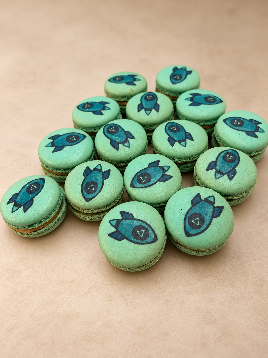 Green macarons printed with navy rocket illustrations