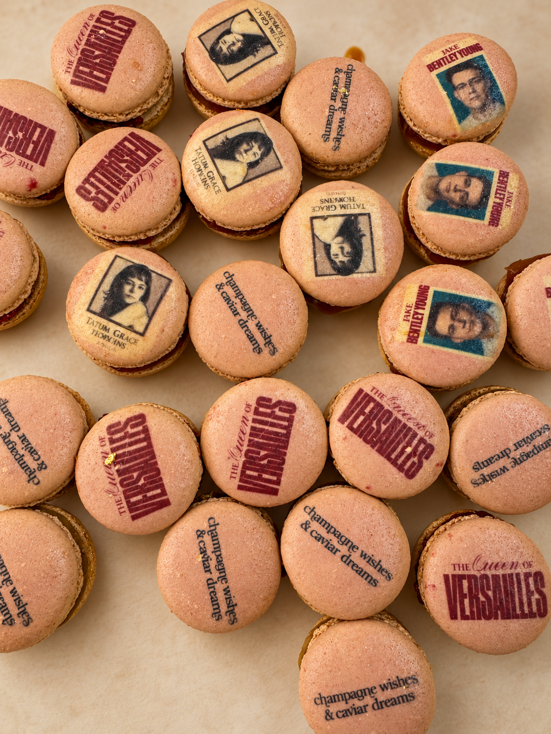 Gold and pink macarons printed with vintage portrait photos and Versailles party text